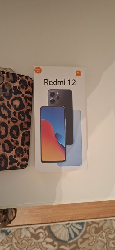 redmi 5 a: Redmi 12, 4 GB, rəng - Qara, Sensor, Barmaq izi, İki sim kartlı
