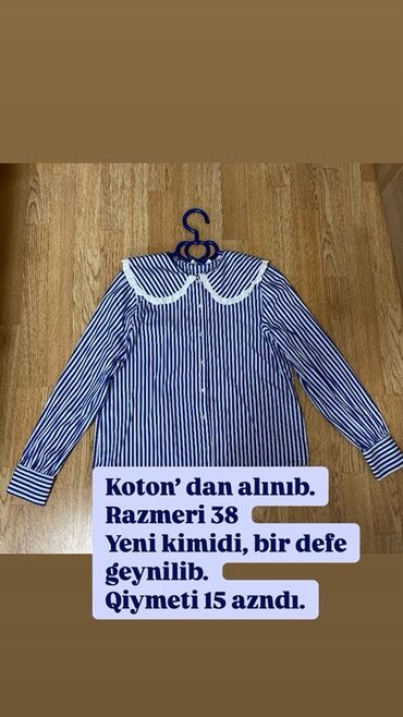Köynək və bluzalar: Zolaqlı, uzunqol köynək. Ağ rəngli, dairəvi yaxası var. Ölçüsü 38.💙
