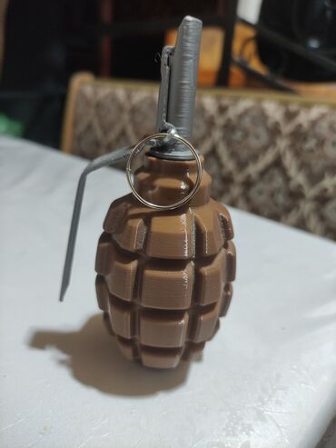 купить пистолет с пластмассовыми патронами: Граната Ф-1 игрушка 
материал пластик