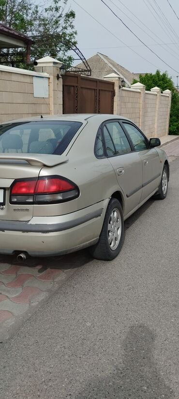626 капелла: Mazda Capella: 1997 г., 1.8 л, Механика, Бензин, Хэтчбэк