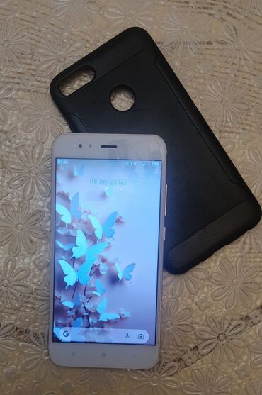 xiaomi mi a1: Xiaomi Mi A1, 64 ГБ, 
 Сенсорный, Отпечаток пальца, Беспроводная зарядка