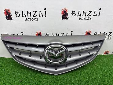 mazda 2000: Решетка радиатора Mazda 2004 г., Б/у, Оригинал — 5