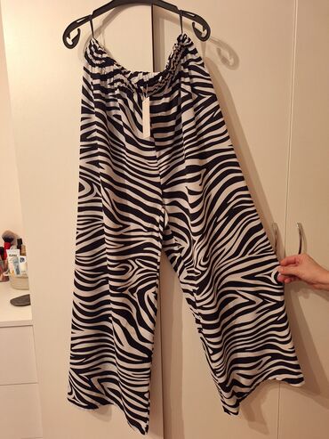 Şalvarlar: Teze.Atlas material.boyuk beden.(48 razmere)Zebra naxışlı, enli