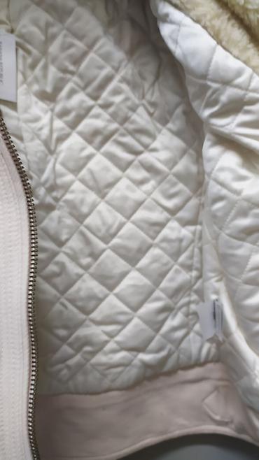 Пуховики и зимние куртки: Женская куртка. Размер L — 8