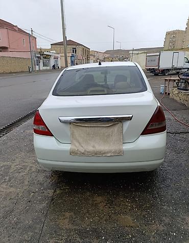 Nissan: Nissan Tiida sedan – ağ rəng Xüsusiyyətlər: - Kuzov: 4 qapılı sedan — 2