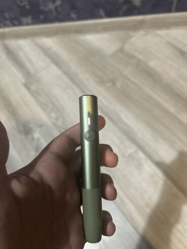 Qəlyan, vayp və aksesuarları: Yaşıl rəngli, qızdırılan tütün məhsulu cihazı. iqos 1 heftedi alinib