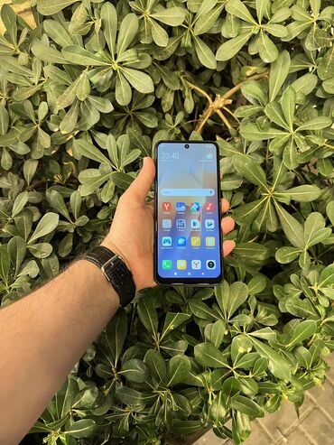 телефон fly e146: Xiaomi Redmi 12, 256 ГБ, цвет - Черный, 
 Отпечаток пальца, Беспроводная зарядка, Две SIM карты