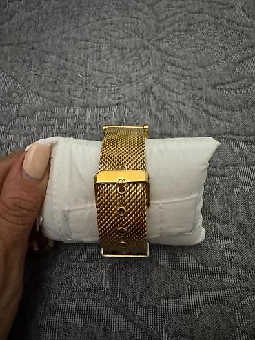 106 saat: Tissot qol saatı. Klassik və zərif dizayna malik model qızılı rəngli — 2
