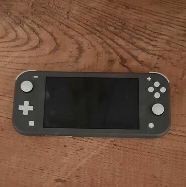 nintendo switch oyun: Nintendo switch lite grey Ela veziyyetdedir. adapteri qutusu var