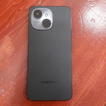 nar paketler: Smartfon – böyük ekranlı, ön hissədə mərkəzləşmiş “notch” kəsiyi və — 2