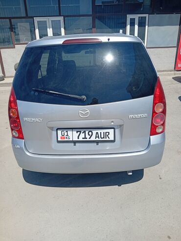 приматок прямоток: Представлен минивэн Mazda Premacy серебристого цвета, отличающийся