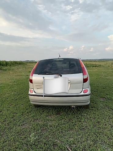 машина на час: Nissan Almera Tino: 2002 г., 2 л, Вариатор, Бензин — 2