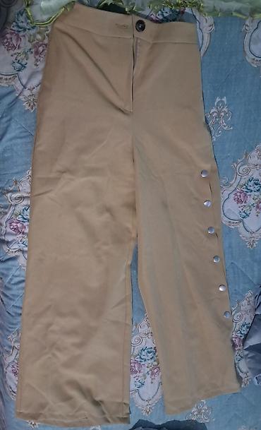 Bej rəngli qadın şalvarı - Model: Geniş kəsim, düz balaq - Material