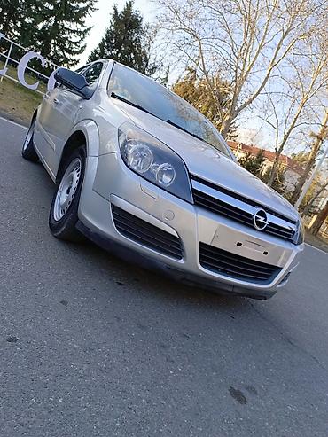 Opel: Opel Astra H – gümüşü rəng, 5 qapılı hetçbek.Hazır maşındı.ikinci — 8