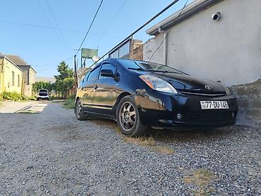 Avtomobil satışı: Toyota Prius (2-ci nəsil) – qara rəngli, hatchback kuzov. Əsas — 1