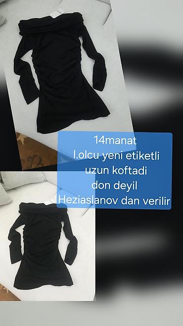 Qara rəngli, uzun model qadın koftası. Şəkildə göründüyü kimi don
