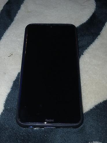 philips xenium 9@9u: Mavi rəngdə sadə və yüngül mobil telefon. Arxa qapaqda mərkəzdə uzanan — 2
