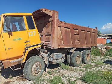 с кму: Самосвал CAMC (кабина с надписью STEYR), 6x4. Особенности: - Колесная — 3