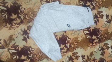 спец одежда военный: Серые спортивные брюки Nike - Модель: джоггеры с манжетами по низу -