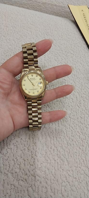 Rolex Oyster Perpetual Datejust qol saatı – qızılı rəngdə - Korpus və