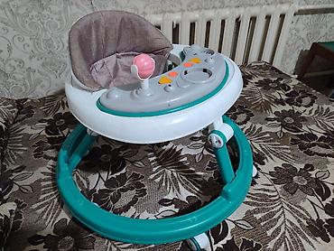 Детские ходунки с игровой панелью. - Круглая устойчивая база на