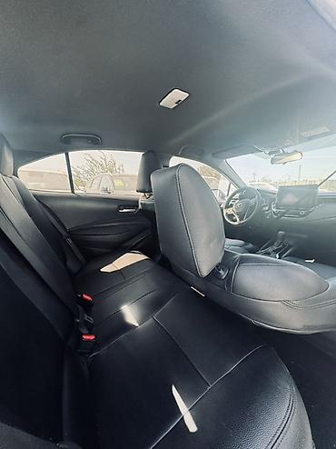 byd e1: Toyota Corolla: 2023 г., 1.8 л, Вариатор, Гибрид, Седан — 7