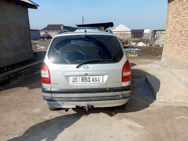 купить опель вектра б: Серебристый минивэн Opel Zafira, оснащенный багажником на крыше и