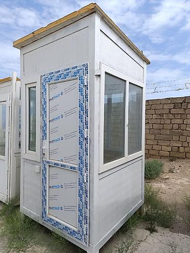 Həyət darvazaları: Mühafizə köşkü möhkəm konstruksiyaya və geniş görünüşə malikdir. Ağ — 2