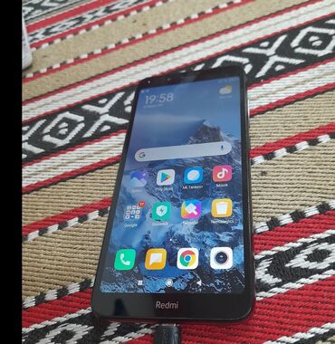 telefon kabrolar: Xiaomi Redmi 7A, 32 GB, rəng - Qırmızı, 
 Zəmanət, Sensor, İki sim kartlı