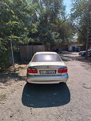 tayota vitz: Mazda : 2001 г., Автомат, Бензин, Седан — 1