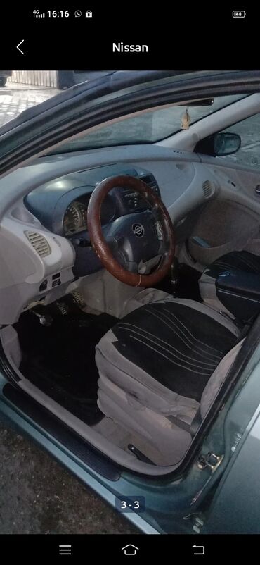 электромобиль neta: Хэтчбек Nissan Almera в светло-зеленом цвете, подходящий для