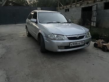 мото зонтик: Mazda Familia: 1999 г., 1.5 л, Автомат, Бензин, Универсал — 5