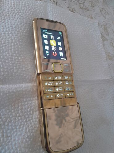 Digər mobil telefonlar: Qızılı korpuslu sürüşdürmə mexanizmalı düyməli mobil telefon — 9