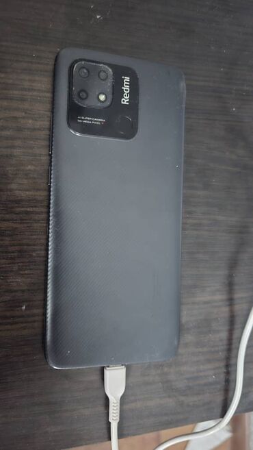телефон в таласе: Смартфон Redmi 10C в темно-сером цвете с матовой текстурой задней