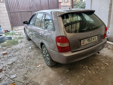 кружка для машины: Mazda 323: 2003 г., 1.6 л, Механика, Бензин, Хетчбек