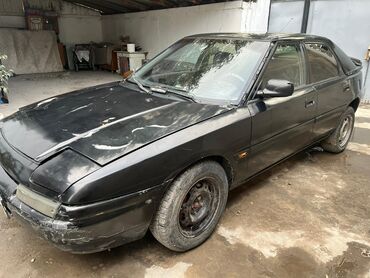 машина электронный: Mazda 323: 1992 г., 1.8 л, Механика, Бензин