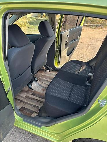 Daihatsu Cuore: 2008 г., 1 л, Механика, Бензин, Хэтчбэк — 6