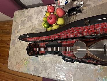 gitara satilir: Tar – milli simli musiqi aləti, sərt futlyarla Xüsusiyyətlər: - — 2