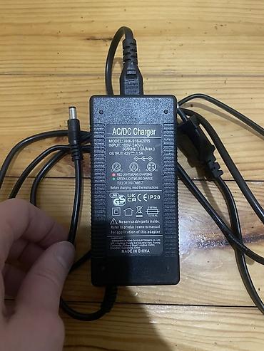 Техника и электроника: AC/DC adapter/şarj cihazı Model: XHK-916-42015 Giriş (Input) — 1