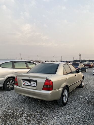 Mazda: Mazda 323: 2000 г., 1.5 л, Механика, Бензин, Седан — 2