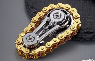 Игрушки: Небольшой спиннер из металла, выполненный в виде велосипедной цепи — 10