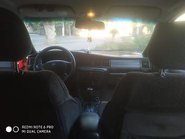 opel 1 3: Opel Astra Vectra (ünvan nömrəsi görünür), qırmızı rəngli universal — 6