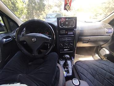 bmw e 38: Opel Astra: 1.6 l | 1999 il 400 km Sedan — 10