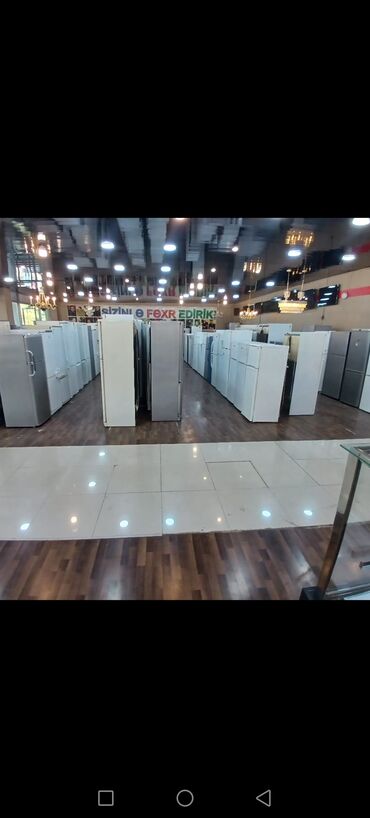 xaladelnik satisi: Məişət texnikası mağazasında müxtəlif növ soyuducular - Tip