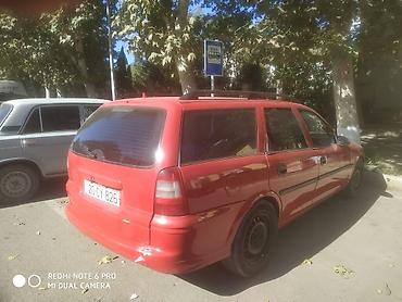 opel 1 3: Opel Astra Vectra (ünvan nömrəsi görünür), qırmızı rəngli universal — 2