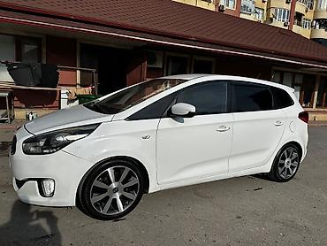 kia sedd: Kia Carens, ağ rəng, 5 qapılı kompakt MPV. Xarici: - LED gündüz — 5