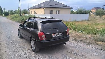 mazda cx: Mazda 323: 2003 г., 1.6 л, Механика, Бензин, Хэтчбэк — 2