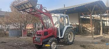 Тракторы ДТ-75: Трактор с фронтальным погрузчиком и навесным оборудованием Описание — 9