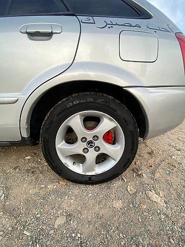 передвижные дома: Mazda Familia: 2001 г., Бензин, Хэтчбэк — 4
