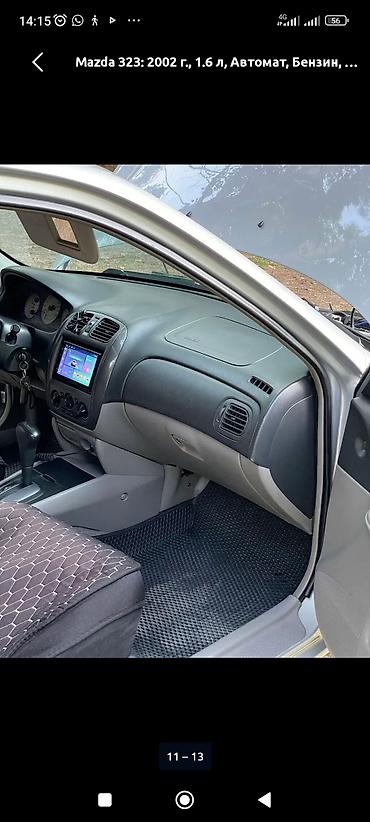 byd e1: Mazda 323: 2002 г., 1.6 л, Автомат, Бензин, Универсал — 8
